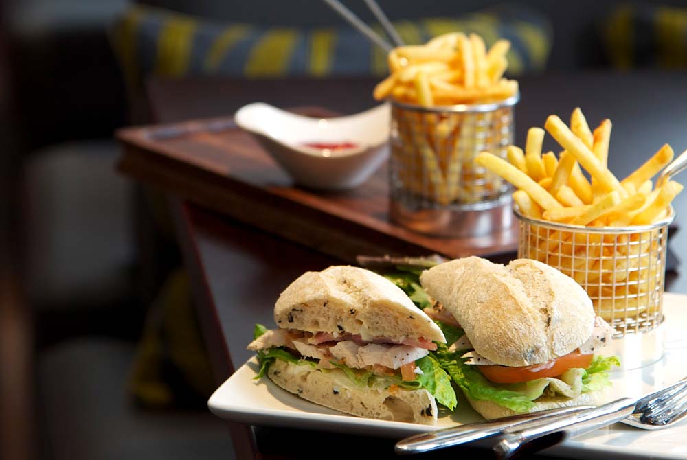 A delicious looking Club sandwich and fries