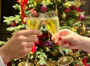 Champagne glasses in front of christmas tree