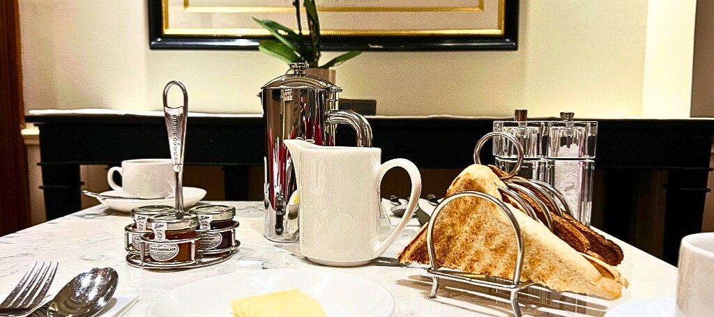 Toast, tea, and coffee arranged on a table, perfect for starting the day.