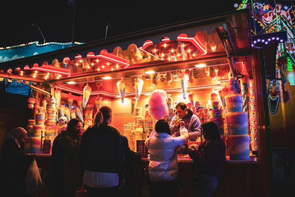 people buying candy floss at a stall at the hyde park christmas market