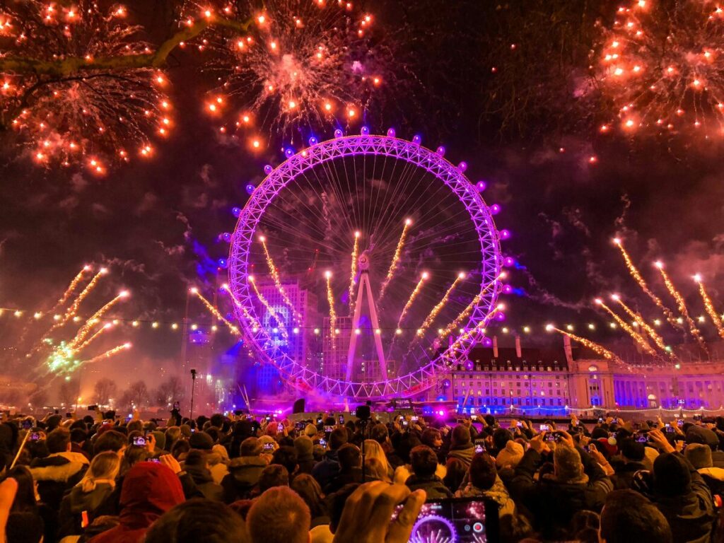 a view of the london eye with fireworks on nye night